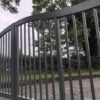 Angled view of modern steel gate with straight vertical bars