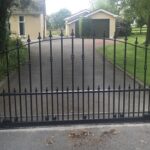 automated sliding gate with vertical bars - arrows on top